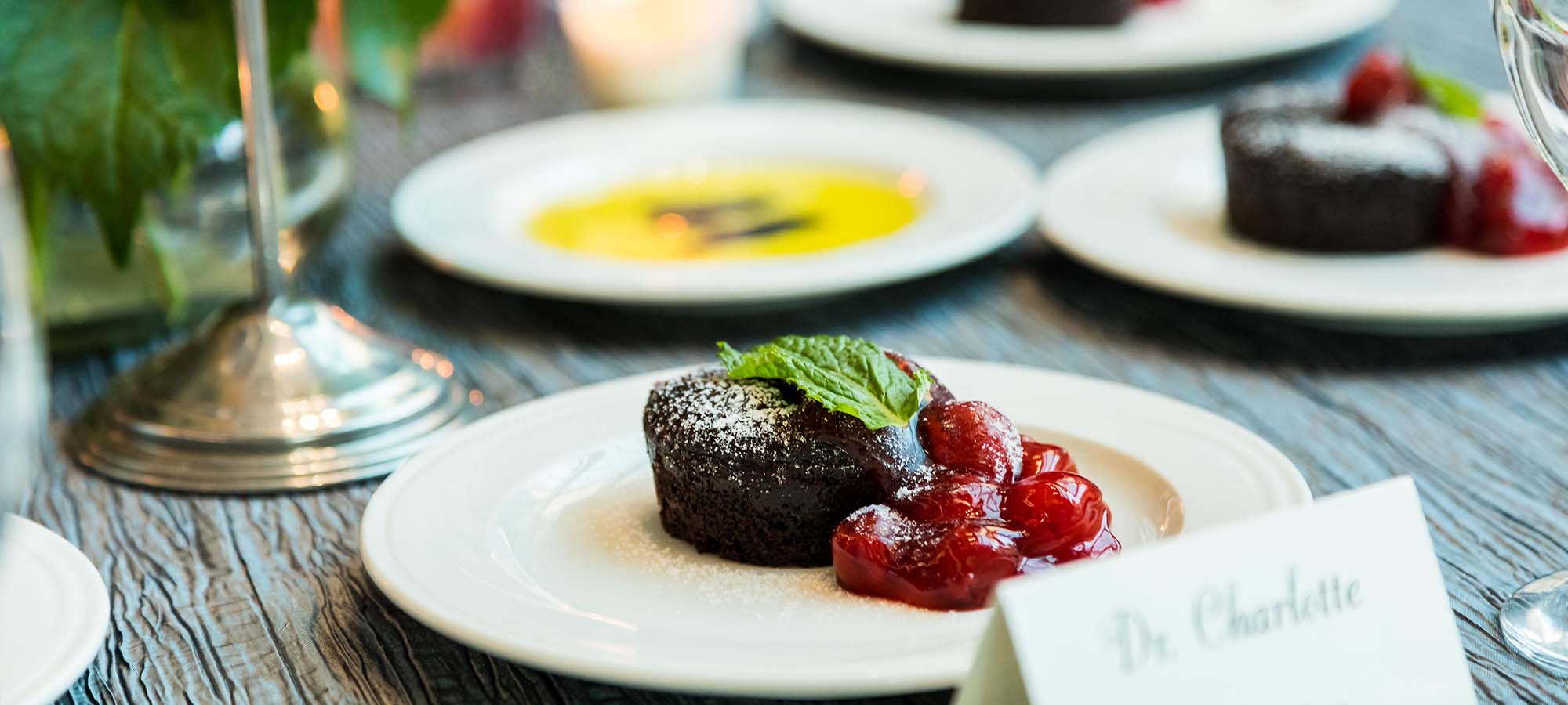 plated chocolate dessert with cherry filling